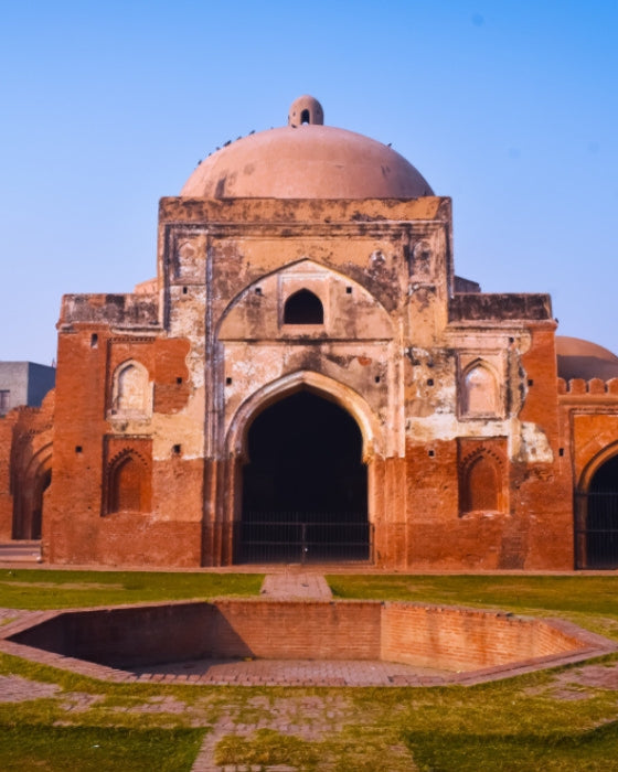 Landscape-photos-of-Kabuli-bagh-masjid-front-side-with-one-side-damaged-Tomb-and-wall-blue-sky-and-green-grass-Panipat-India_1.jpg