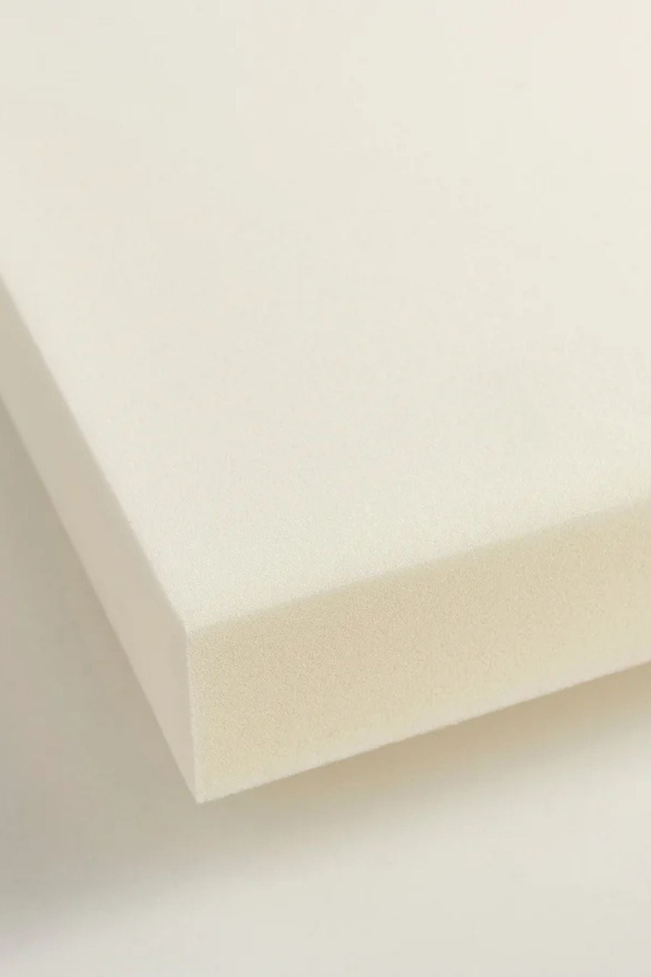 White hypoallergenic foam sheet from a Shakti Classic Acupressure Mat on a white background.